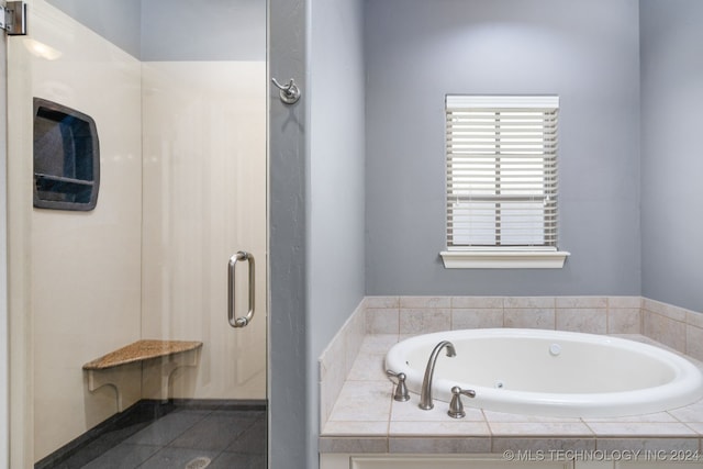 bathroom with separate shower and tub