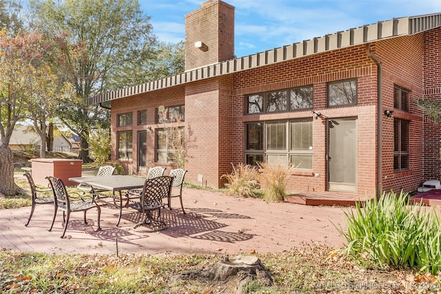 back of property featuring a patio area