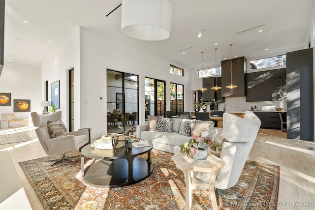 living room with a high ceiling