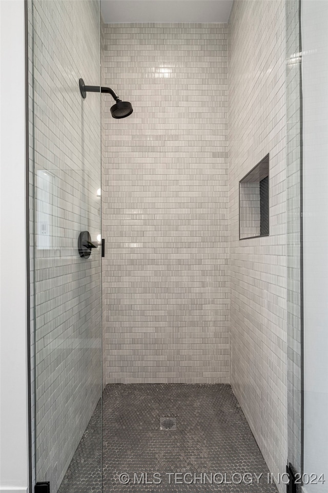 bathroom with a shower with shower door