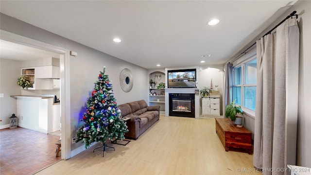 living room with plenty of natural light and light wood-type flooring