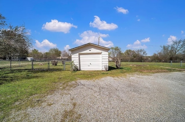 garage featuring a rural view