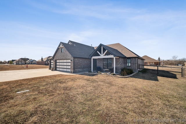 view of front of house with a garage and a front yard