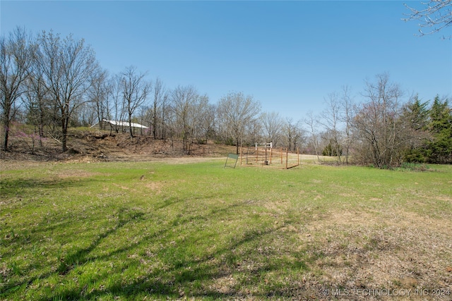 view of yard featuring a rural view and a playground