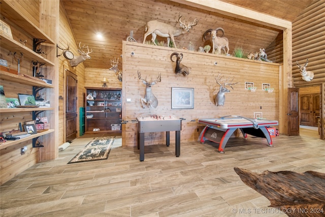 rec room with light hardwood / wood-style floors, lofted ceiling, and wood ceiling