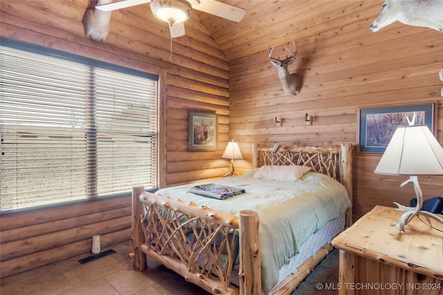 bedroom featuring tile patterned floors, ceiling fan, and lofted ceiling