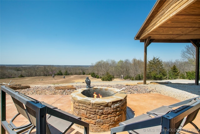 view of patio with a fire pit