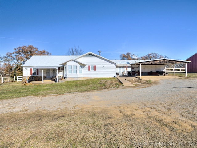 ranch-style home featuring a carport