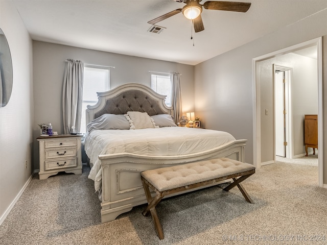 bedroom featuring ceiling fan and light carpet