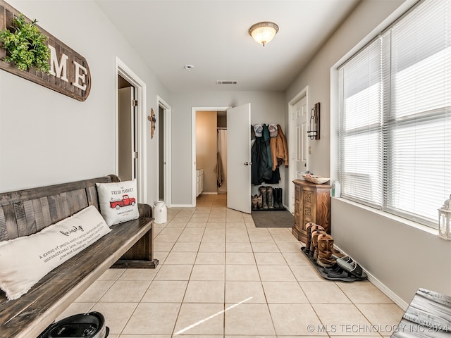 hallway with light tile patterned floors