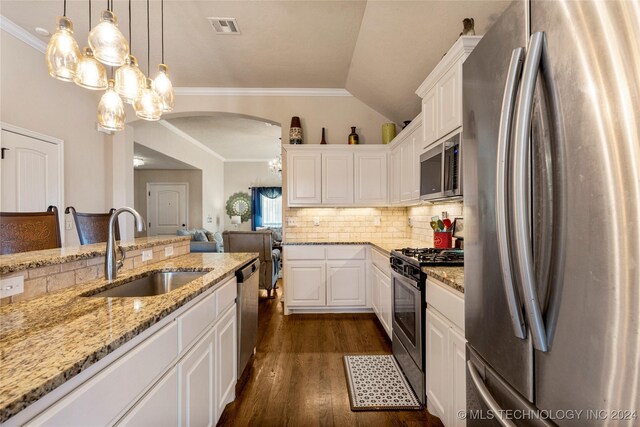 kitchen with stainless steel appliances, white cabinets, visible vents, and a sink