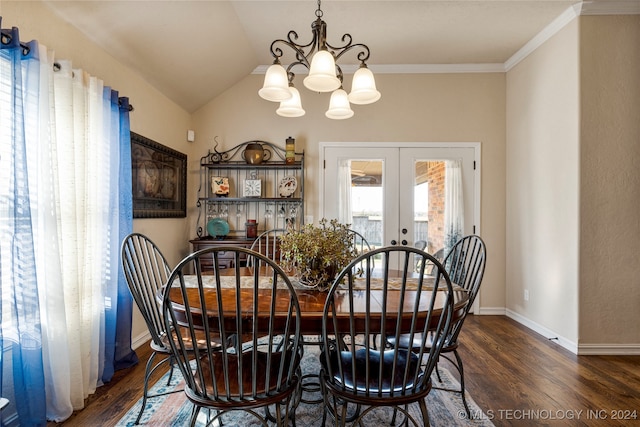 dining room with french doors, an inviting chandelier, dark wood-type flooring, and crown molding