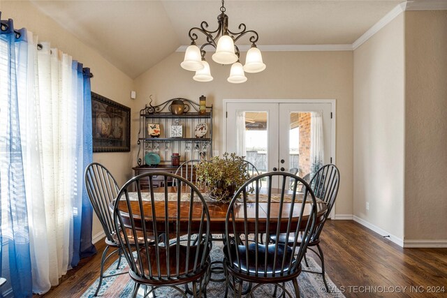 dining space with baseboards, lofted ceiling, wood finished floors, french doors, and a chandelier