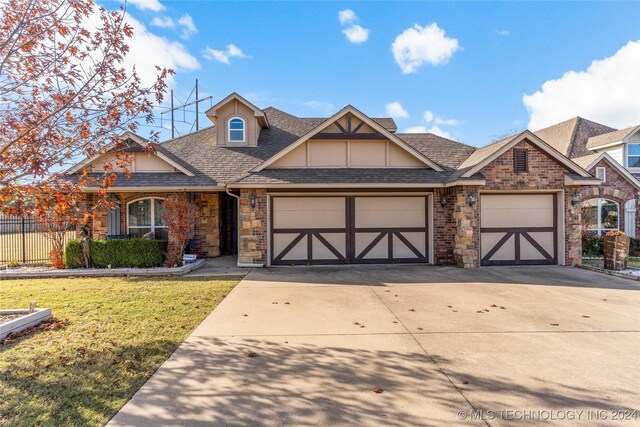 view of front of home featuring a front lawn and a garage