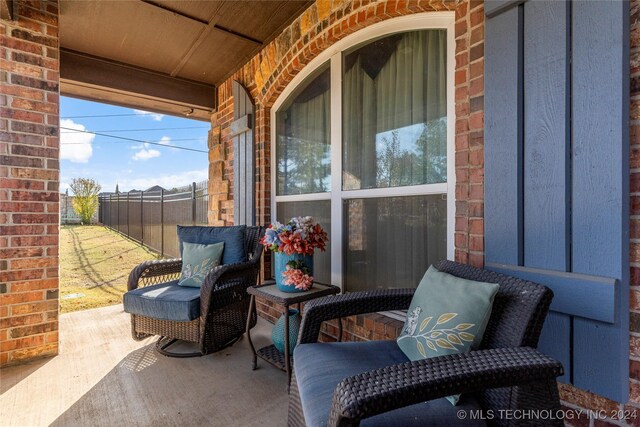 view of patio / terrace featuring fence