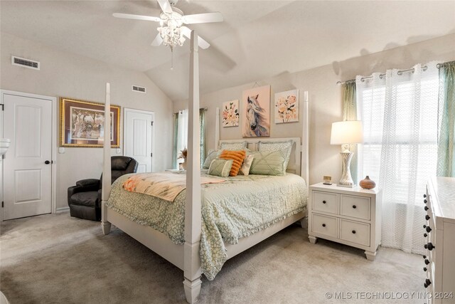 bedroom with light carpet, ceiling fan, vaulted ceiling, and visible vents