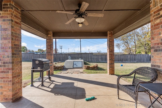 view of patio with grilling area and ceiling fan