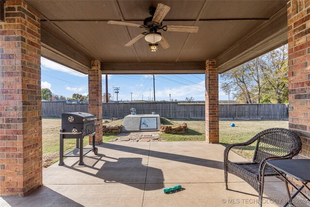 view of patio with a fenced backyard, a ceiling fan, and area for grilling