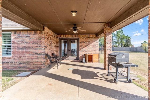 view of patio / terrace featuring ceiling fan and french doors