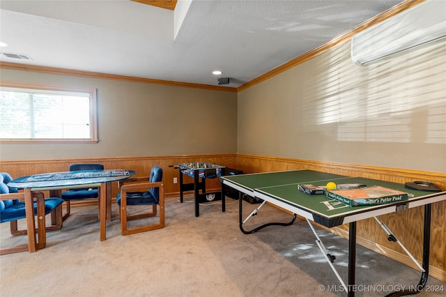 playroom with a wall mounted AC, wood walls, a textured ceiling, light carpet, and ornamental molding