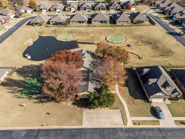 aerial view featuring a residential view and a water view