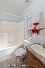 full bathroom with vanity, toilet, and shower / bathtub combination