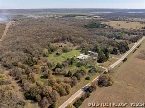 birds eye view of property with a rural view