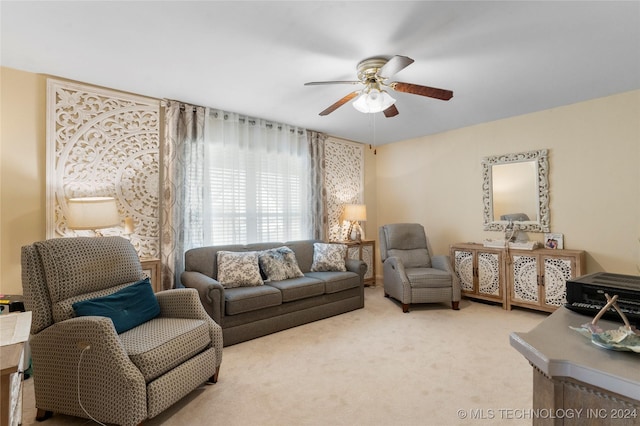 carpeted living room with ceiling fan