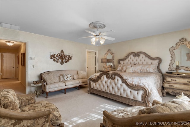 carpeted bedroom with ceiling fan