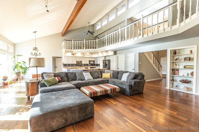 living room featuring ceiling fan with notable chandelier, hardwood / wood-style flooring, high vaulted ceiling, and a wealth of natural light