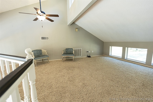 additional living space with carpet, lofted ceiling with beams, and ceiling fan