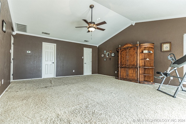 interior space featuring ornamental molding, carpet floors, ceiling fan, and lofted ceiling