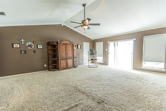 unfurnished living room with carpet flooring, ceiling fan, lofted ceiling, and ornamental molding