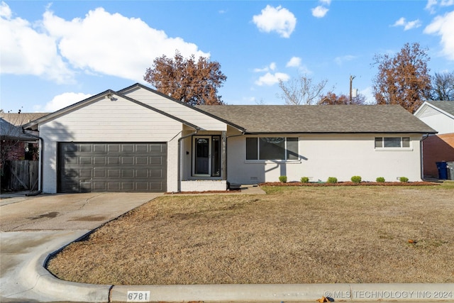 ranch-style home with a garage and a front yard