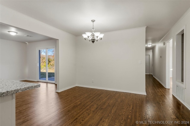 unfurnished dining area featuring a notable chandelier, crown molding, and dark wood-type flooring