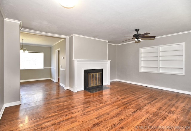 unfurnished living room with ceiling fan with notable chandelier, dark hardwood / wood-style floors, built in features, a textured ceiling, and ornamental molding