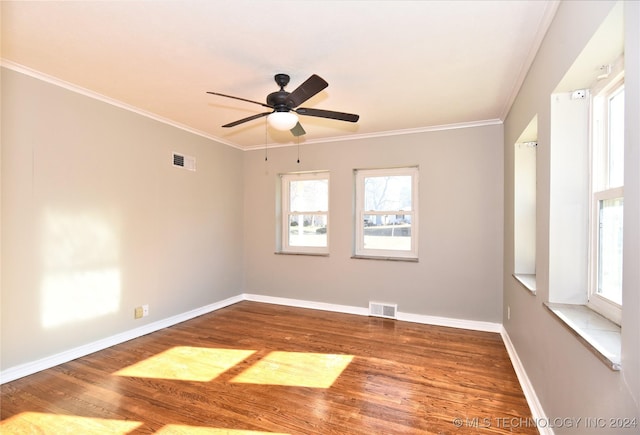 empty room featuring crown molding, hardwood / wood-style floors, and ceiling fan