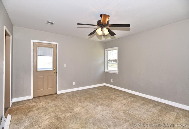 unfurnished room featuring carpet flooring and ceiling fan