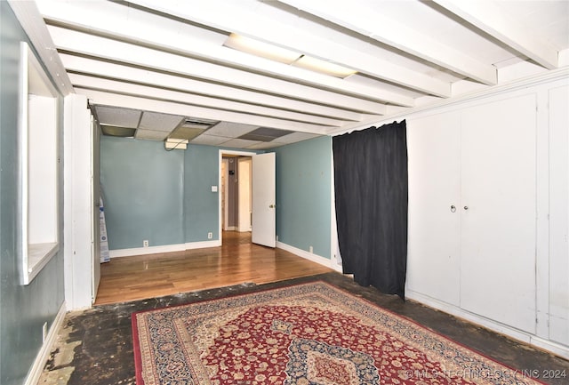 unfurnished room with dark wood-type flooring