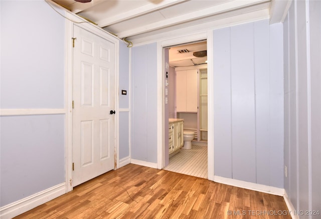 corridor featuring light hardwood / wood-style floors