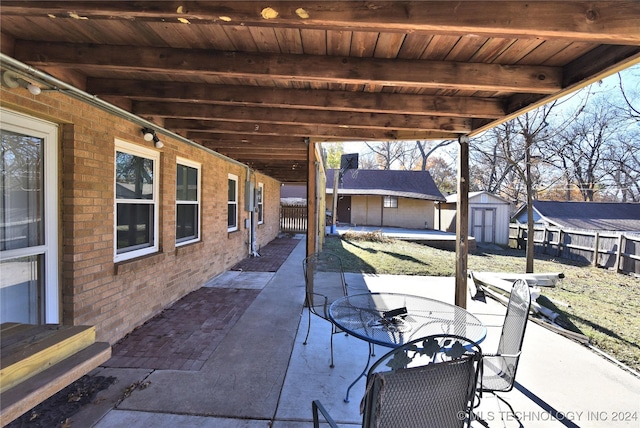 view of patio / terrace with a storage unit