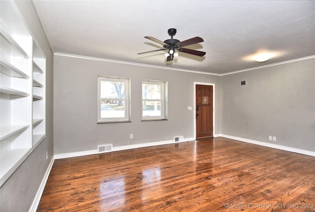 spare room with dark hardwood / wood-style floors, ceiling fan, and ornamental molding