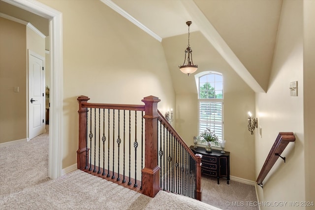 stairs featuring carpet, vaulted ceiling, and crown molding