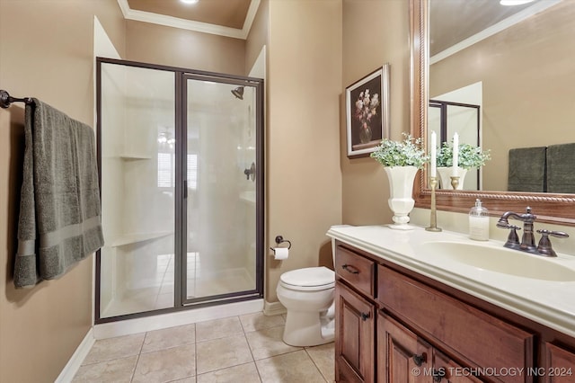 bathroom with vanity, tile patterned floors, crown molding, toilet, and a shower with shower door