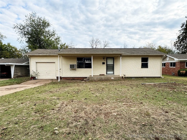 single story home with an AC wall unit, a front lawn, and a garage