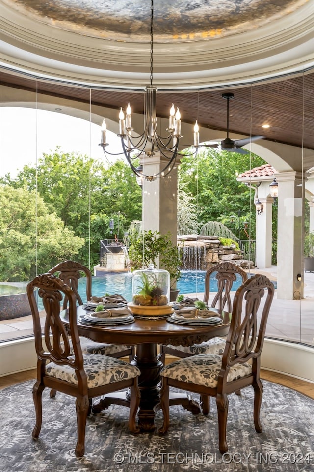 dining area featuring an inviting chandelier, a wealth of natural light, and ornamental molding