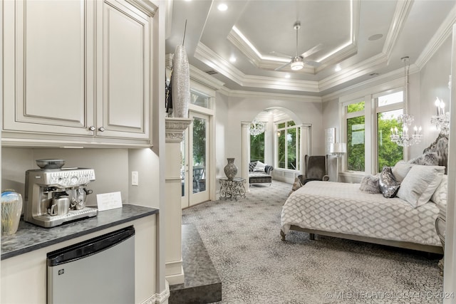 carpeted bedroom with stainless steel refrigerator, ceiling fan, french doors, a raised ceiling, and ornamental molding