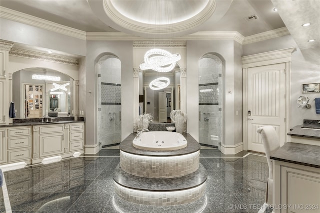 bathroom featuring vanity, a raised ceiling, independent shower and bath, and a chandelier