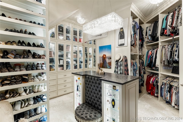 walk in closet featuring light carpet