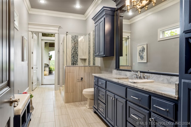 bathroom with vanity, a shower with shower door, and ornamental molding